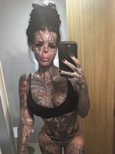 Tattoed woman who keeps her nose in a jar reveals what she looked like before